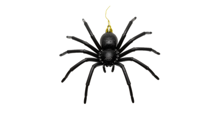 Black Spider Ornament with Yellow Hanging String Against a Dark Background