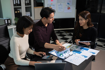 Businessmen team or financial data analysts working with tablets and laptop computers and data graphs together. Plan to analyzing projects in the office.