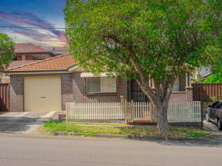 Beautiful colours of a Spring Sunset over Residential houses in inner Sydney suburb of Ashbury NSW Australia Double Brick federation house western sydney 