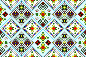 A colorful seamless geometric pixel art textile pattern with intricate cross-stitch motifs. Vector pixel art geometric pattern creating a vibrant traditional design