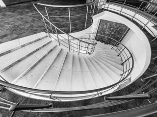 Curves of Ascent — Spiral Staircase Elegance. Monochrome Hues.