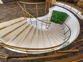 Curves of Ascent — Spiral Staircase Elegance.