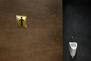 Men's Restroom Minimalism — Golden Square and Black Figure.