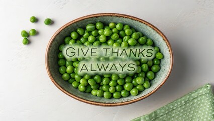 Bowl of green peas with encouraging message viewed from above