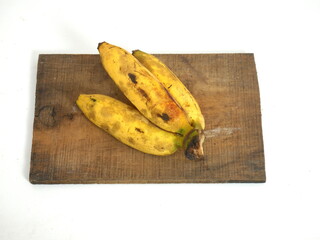 Fresh Yellow Bananas Placed on Vintage Wooden Board
