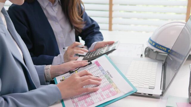 Expert woman asian people discuss review data number costing managerial account prepare monthly actual cost variance report income tax at audit office. ESG budget control ERP process service project.