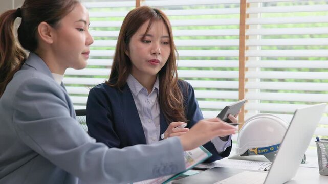 Expert woman asian people discuss review data number costing managerial account prepare monthly actual cost variance report income tax at audit office. ESG budget control ERP process service project.