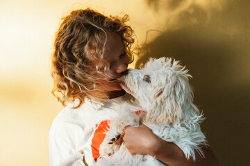 Young Girl Embraced by Puppy Sharing Affectionate Licks