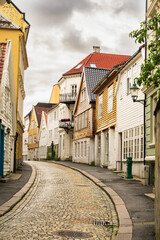 Bergen street featuring colorful traditional wooden houses lining a winding cobblestone road