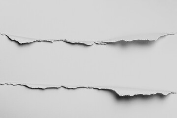 Torn white paper with rough edges, revealing a gap between the two sections.