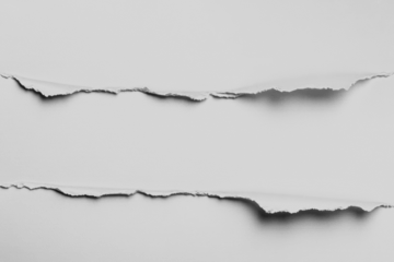 Torn white paper with rough edges, revealing a gap between the two sections.