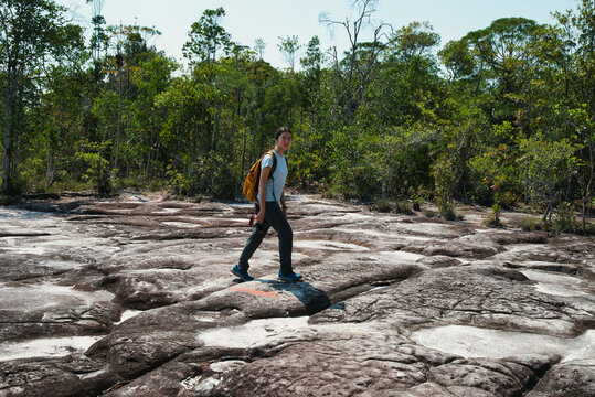 Girl hiking in the deep forest of Bako National Park, on the island of Borneo, Malaysia.