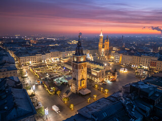 Main Square in Krakow, Poland with Town Hall Tower, Cloth Hall, St Marys Church and Christmas fairs