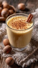 Delicious homemade eggnog with nutmeg and cinnamon on a rustic wooden table