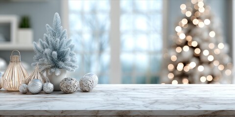 Elegant Christmas arrangement on marble top with a blurred tree in background.