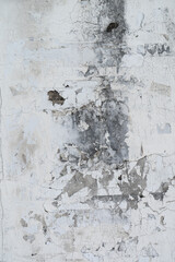 Old grunge wall with white cracked paint texture background