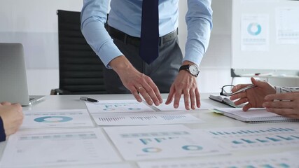 Business team analyzing financial charts and graphs during strategy meeting in modern office, focusing on corporate planning, data analysis, and decision making - Powered by Adobe