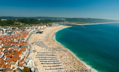 Aerial View of Crowded Nazare Beach, Portugal on a Sunny Summer Day