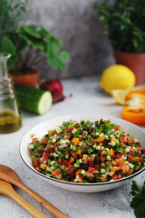A bowl with traditional israeli Salad