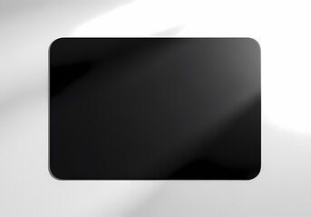 A minimalist black rectangle with rounded corners on a gradient white background with soft lighting