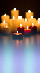 Candle lights glowing against a dark background suitable for background designs