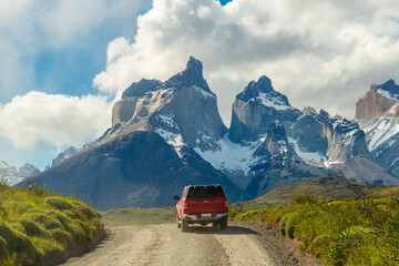 A sport utility vehicle (SUV) driving in Torres del Paine national park, Patagonia, Chile.