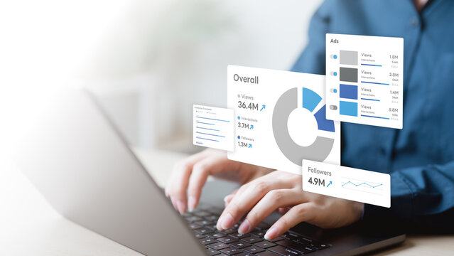 campaign, roas, ads, spend, return, clicks, Hands typing on laptop with digital campaign analytics dashboard showing ROAS, ad spend, clicks, impressions, and performance report for online marketing. - Powered by Adobe