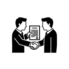 Businessmen shaking hands after signing a contract agreement.