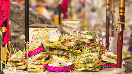 Balinese offerings, incense, fruits, snacks, and money at temple, bali, festival