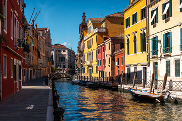 Venice – City of Canals and Bridges. Traditional Venetian Buildings with Boats and Bridges. Romantic Venice, Italy – The Floating City