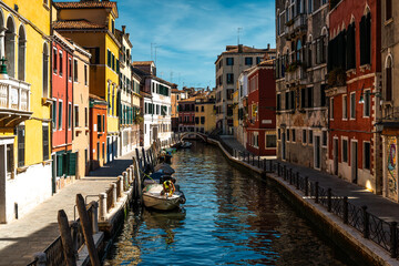 Venice – City of Canals and Bridges. Traditional Venetian Buildings with Boats and Bridges. Romantic Venice, Italy – The Floating City