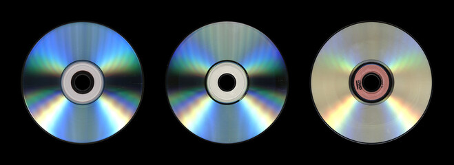 Trio of Compact Discs on Black Background with Rainbow Sheen

