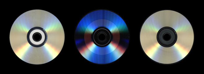Trio of Compact Discs on Black Background with Rainbow Sheen

