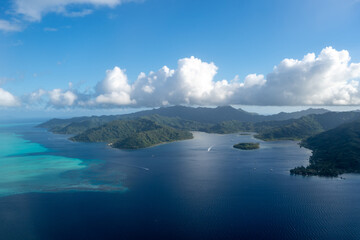 Aerial view of Tahaa island, French Polynesia, with turquoise lagoon and reef