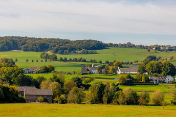 Fototapeta premium Autumn landscape, Terrain hilly countryside in Zuid-Limburg with a small villages on the hillside, farmland and forest, Epen is a village in southern part of the Dutch province of Limburg, Netherlands