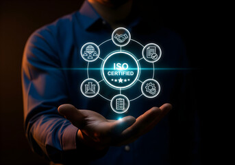 ISO Certification and quality management concept. Businesswoman using laptop with ISO certified and quality assurance icon, international standards, compliance, quality management systems, certificate