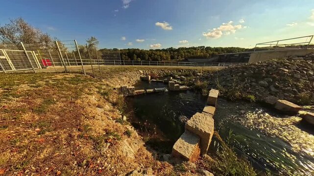 4K Timelapse video with moving clouds and a fish ladder at Zulling, Landau, river, Isar, Dingolfing, Bavaria, Germany