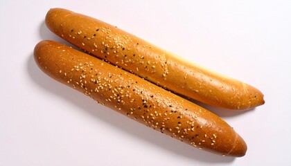 Golden sesame breadsticks on white surface.