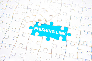Word &ldquo;PHISHING LINK&rdquo; revealed through missing puzzle piece on blue background, symbolizing online scam, cyber attack, data theft, and digital security awareness.