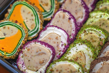 Sliced portions of assorted Turkish delight varieties arranged in neat rows