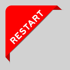 Red color of corner label banner with word restart on gray background