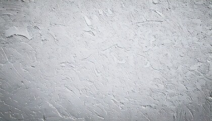 Textured plaster wall reflects light in a modern interior, showcasing subtle patterns and a neutral color palette, creating a sophisticated and minimalist aesthetic.
