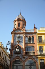 Seville, Spain 03.24.2019: Colourful and ornate buildings line the northern end of Plaza Jesús de la Pasión