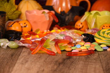 Halloween candies on wooden background stock photo images. Halloween gummy worms candy on a wooden table stock photo images. Template for background, banner, card