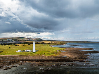 Rain Clouds over Barns Ness Lighthouse from a drone, Dunbar, East Lothian, Scotland, UK