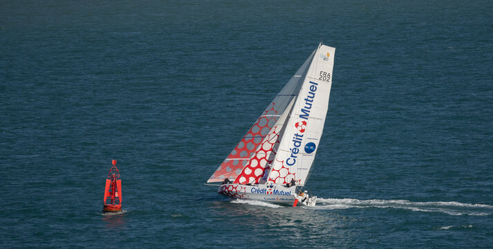 Barcelona, Catalonia, Spain, September 10 2025 ,Sailing Yacht With Credit Mutuel Sails Near Red Buoy On Open Ocean Adventure During Race
