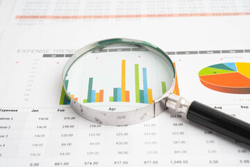 Magnifying glass on charts graphs paper. Financial development, Banking Account, Statistic, Investment Analytic research data economy.