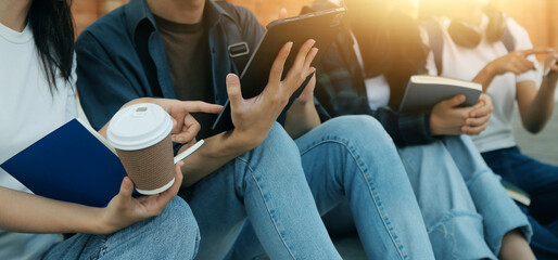 Happy students walking together on university campus, chatting and laughing outdoors after classes