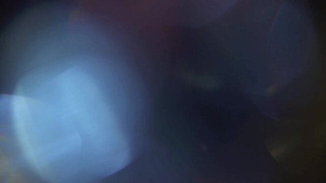 Vibrant light leak bokeh overlay with glowing colors and soft cinematic tones.