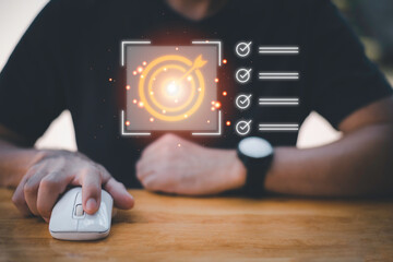 Business planning concept and strategic goal setting and with a businessman pointing at a target icon and checklist. Ideal for success, productivity, project execution and leadership content.